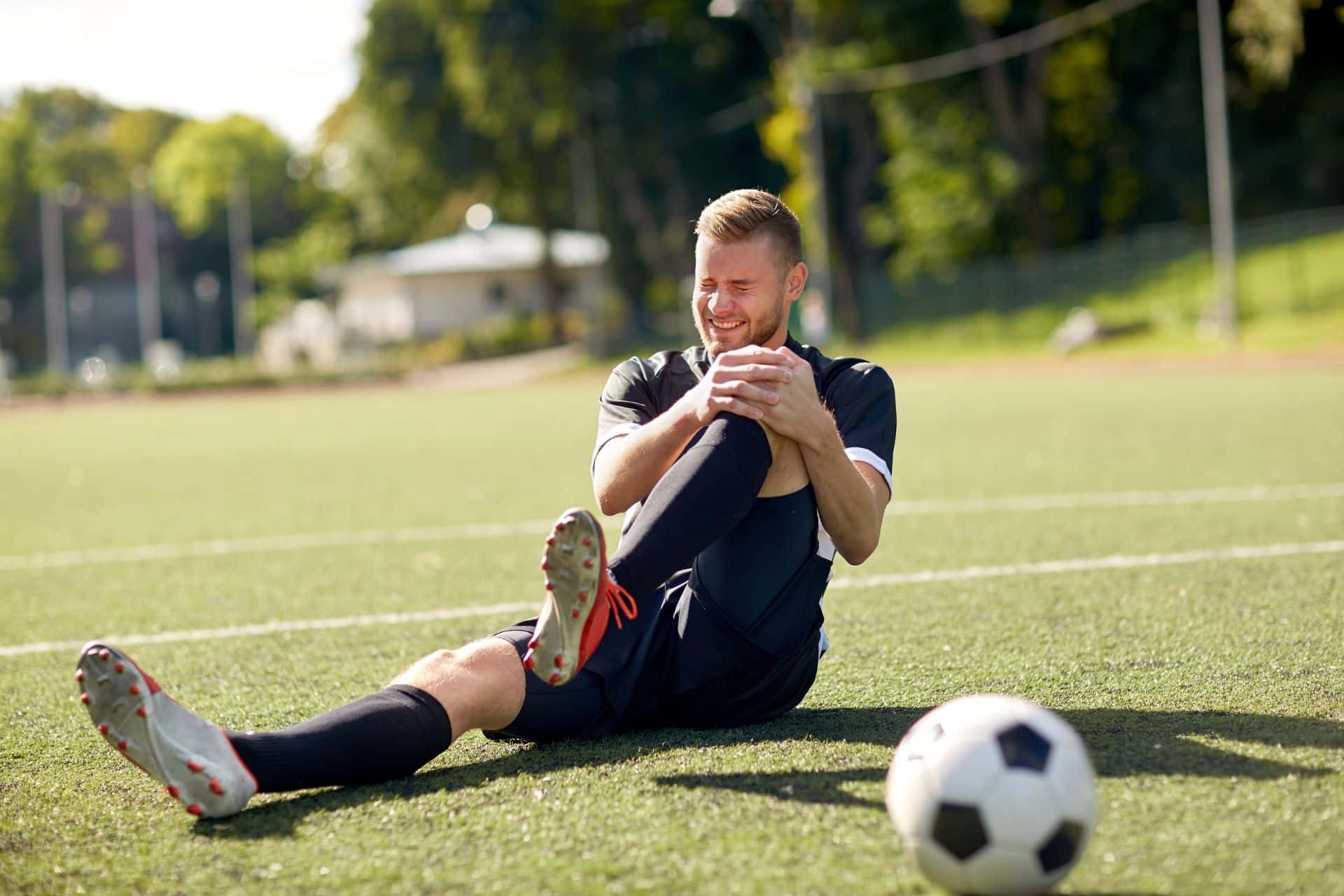 Man sitting on tire with headphones