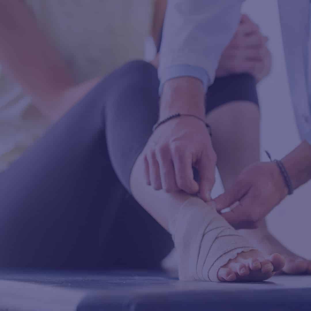 Person wrapping an injured ankle