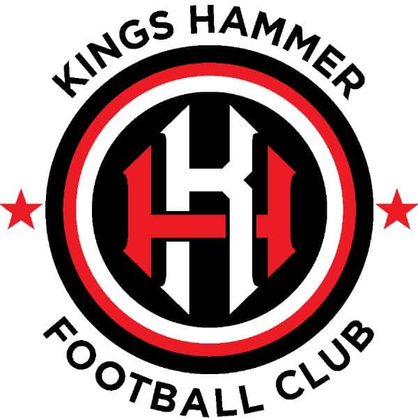 Kings Hammer Football Club logo with black, white, and red colors. A stylized KH is centered in a double circle, flanked by two red stars. The club name forms the outer ring of the logo.