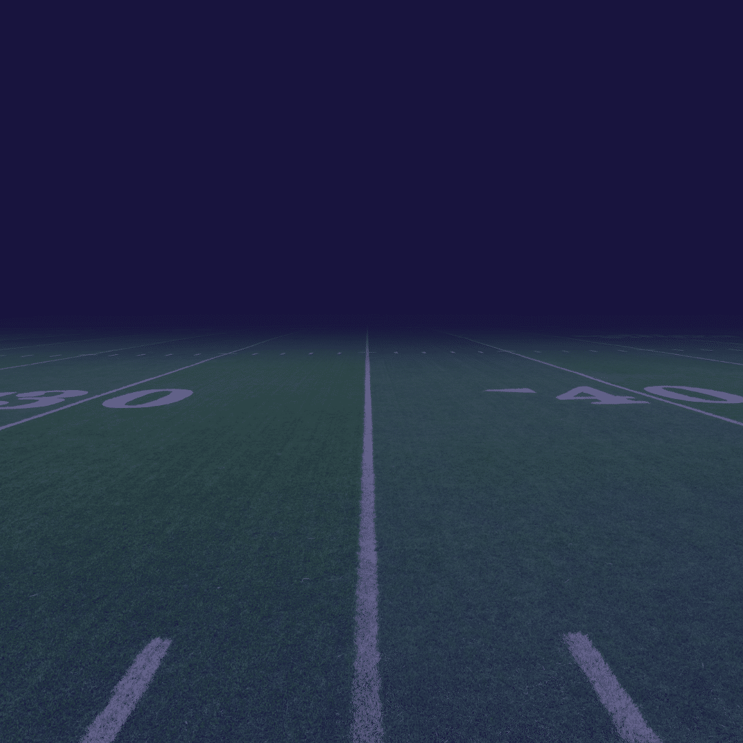 why-do-you-compete-featured A view of a football field at night, showing yard line markings and the 30 and 40 yard line numbers.